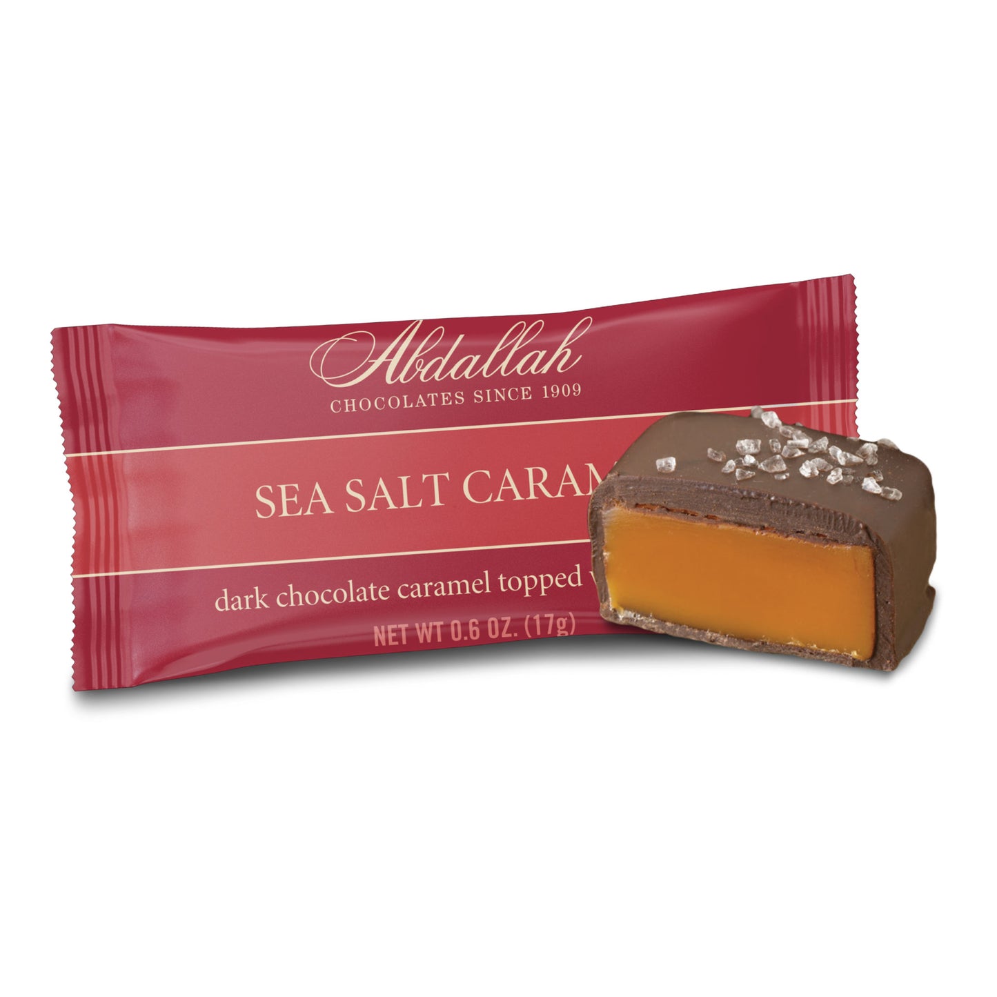 sea salt caramel candy bar wrapper with piece of candy on a white background