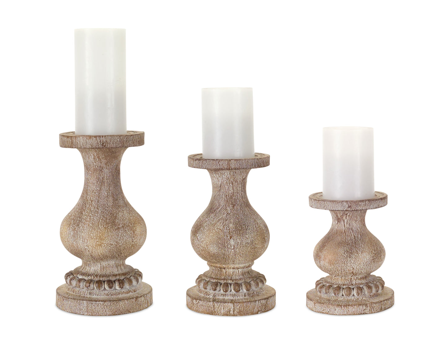 3 sizes of wooden pillar candle holders with beaded base and white pillars on them.
