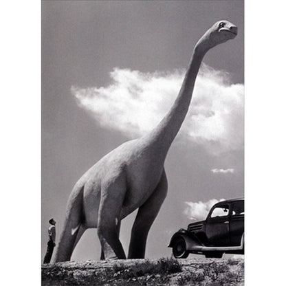 front of card is a black and white photo of a man staring up at an outdoor dinosaur sculpture