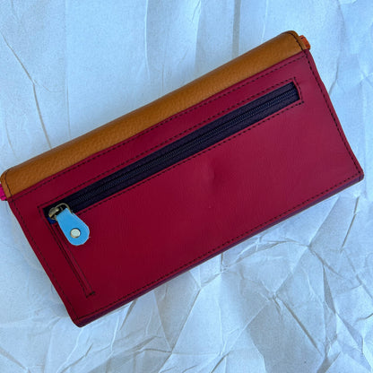 back view of the maroon and mango secret clutch has a zipper pocket