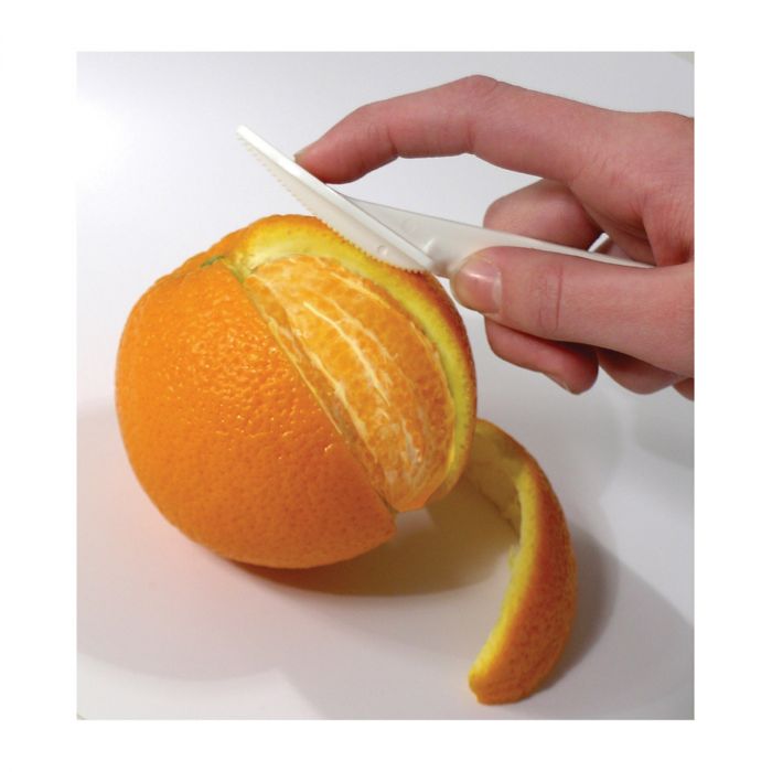 the wing knife orange peeler being used on a orange against a white background