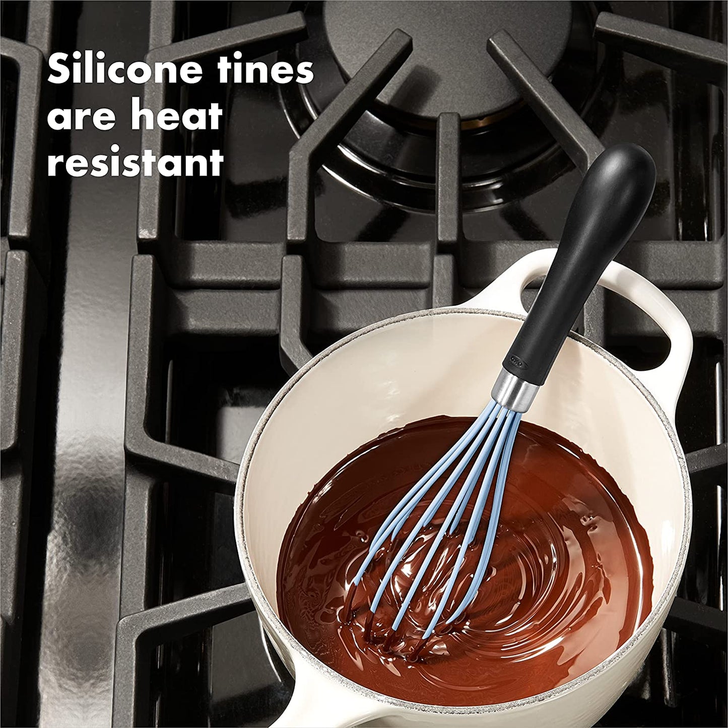 whisk in pot filled with melted chocolate on stove with text "silicone tines are heat resistant".