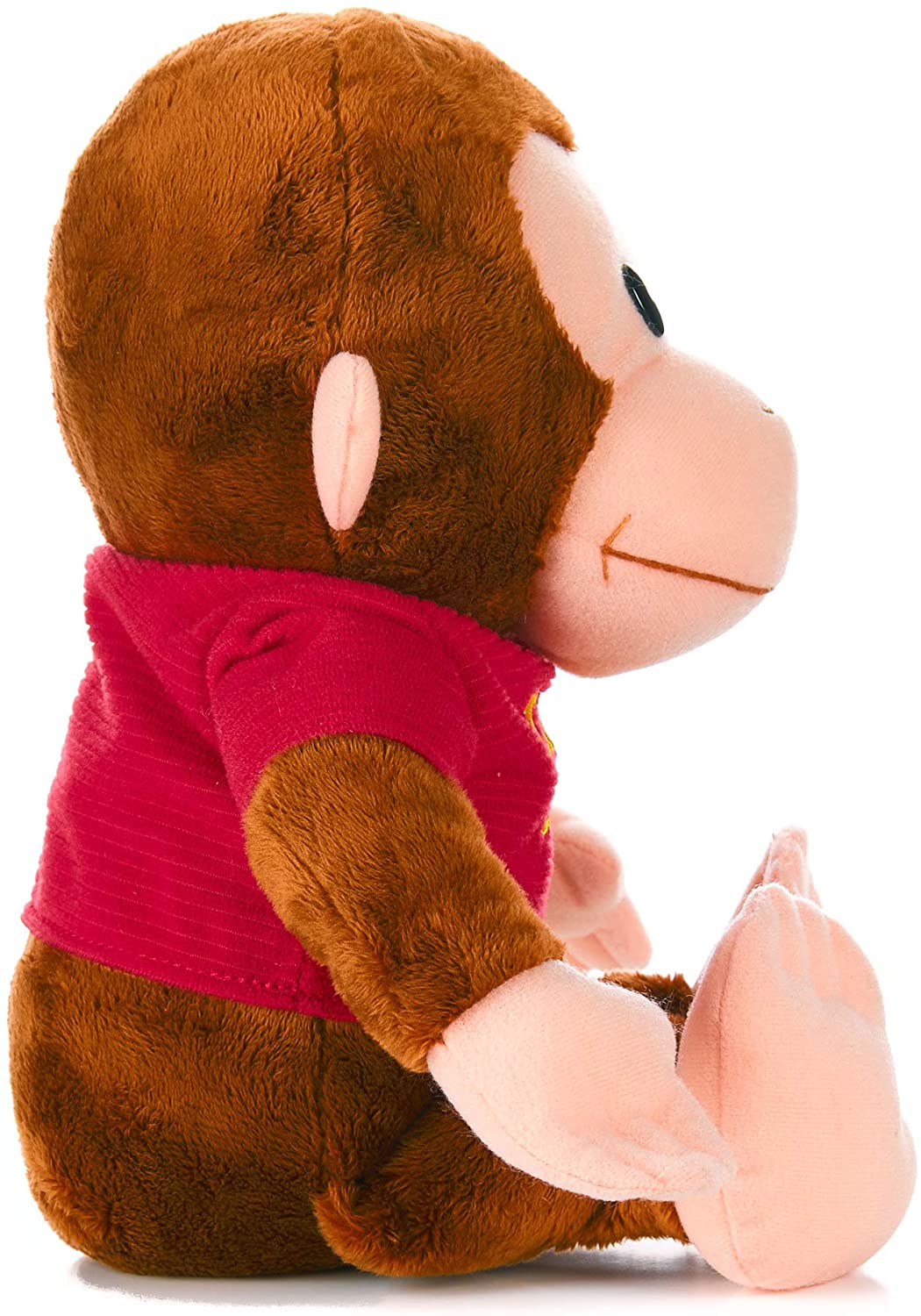 side view of classic curious george plush toy on a white background