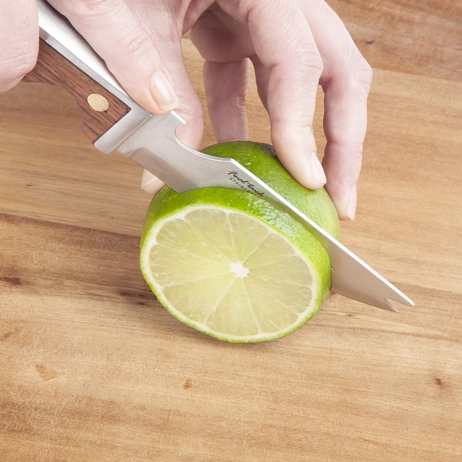 illustration of the bartenders bar knife cutting a lime on a wood surface