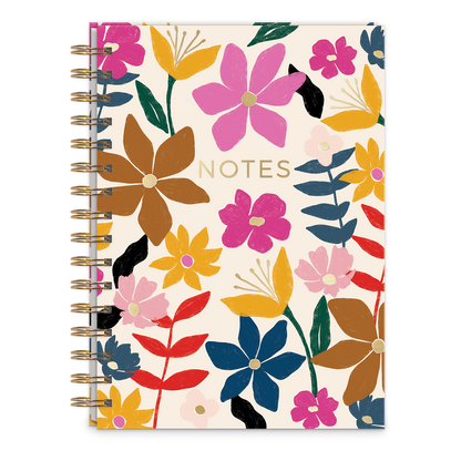 cream colored notebook with gold spiral and all-over floral design.