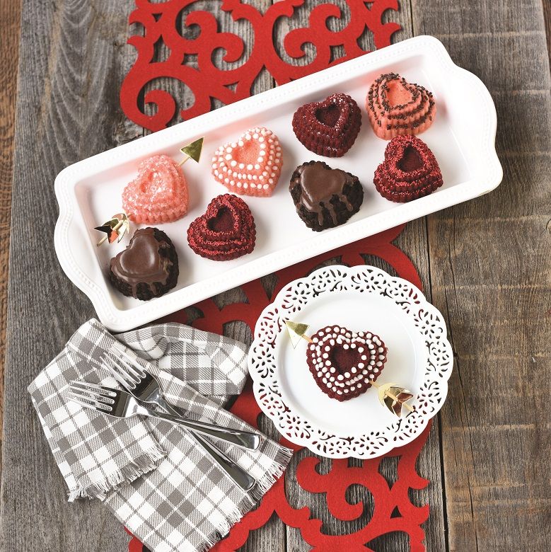 tiered heart cakelets on tray.