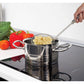 illustration of the small stainless steel spider lifting cooked pasta from a pot on a stovetop against a white background