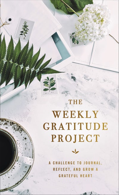 cover of book has flowers, stationary, coffee cup and title