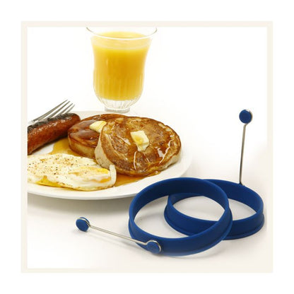plate of pancake and eggs next to pancake rings.
