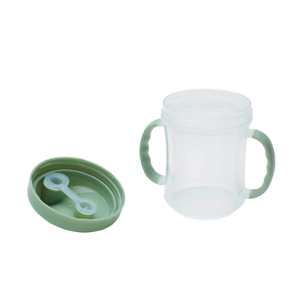 green sippy cup with lid removed.