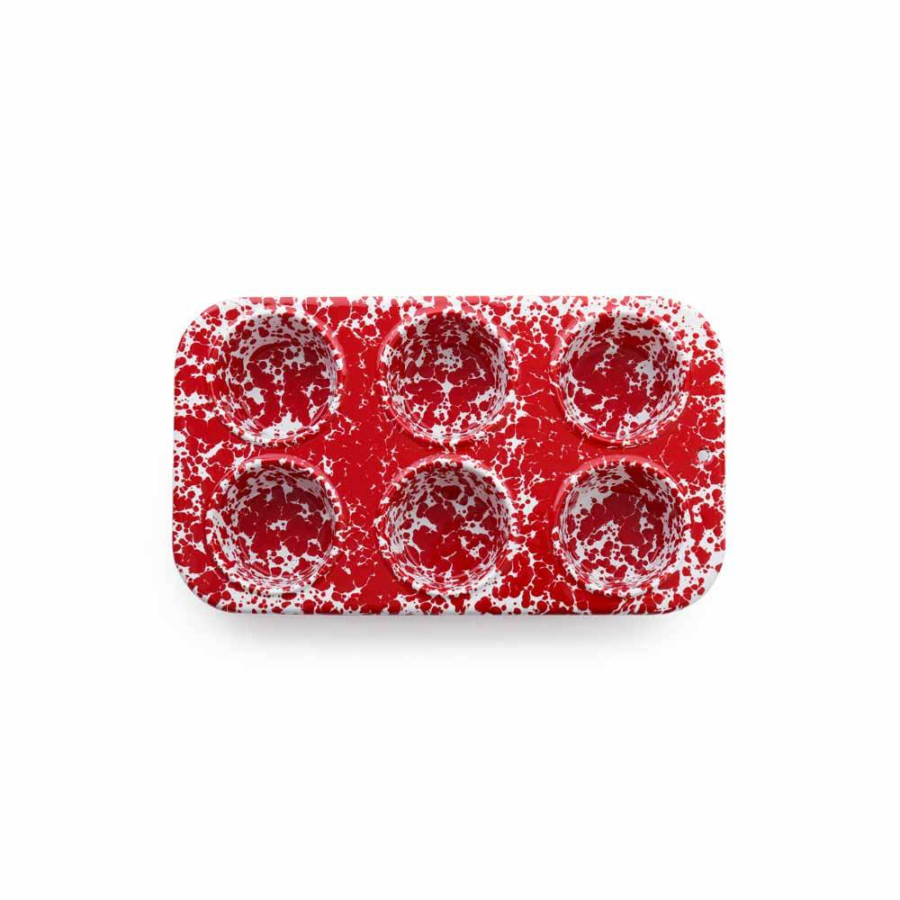 6 cup red muffin tin on a white background