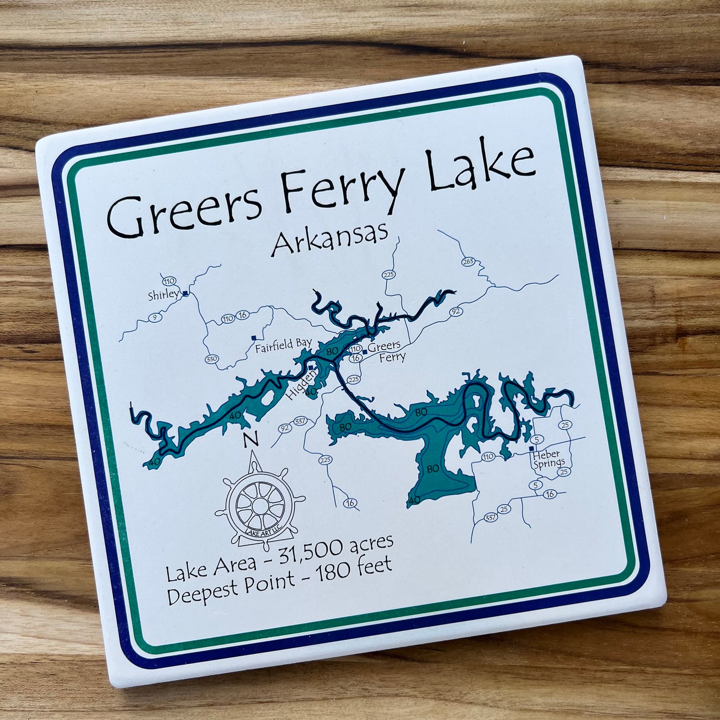 white trivet with map of greers ferry lake printed on it.