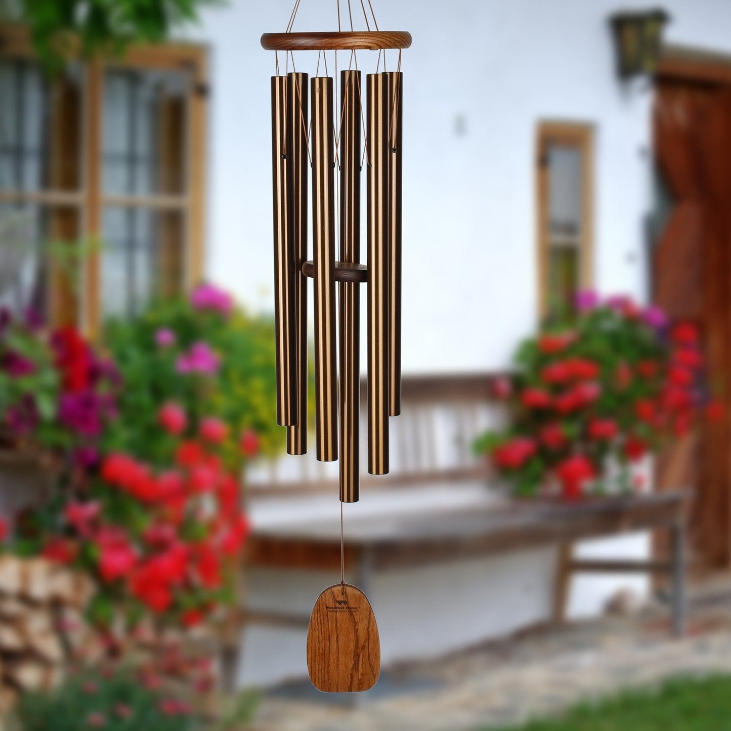 chime with flowers and porch scene in background.