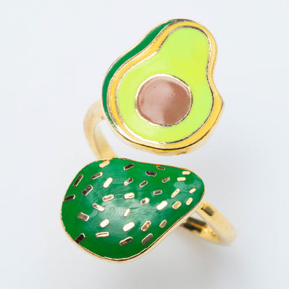 gold adjustable ring with avocados on each side of the adjustment opening.