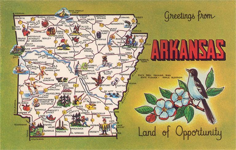 akransas magnet with a map of the state on a white background