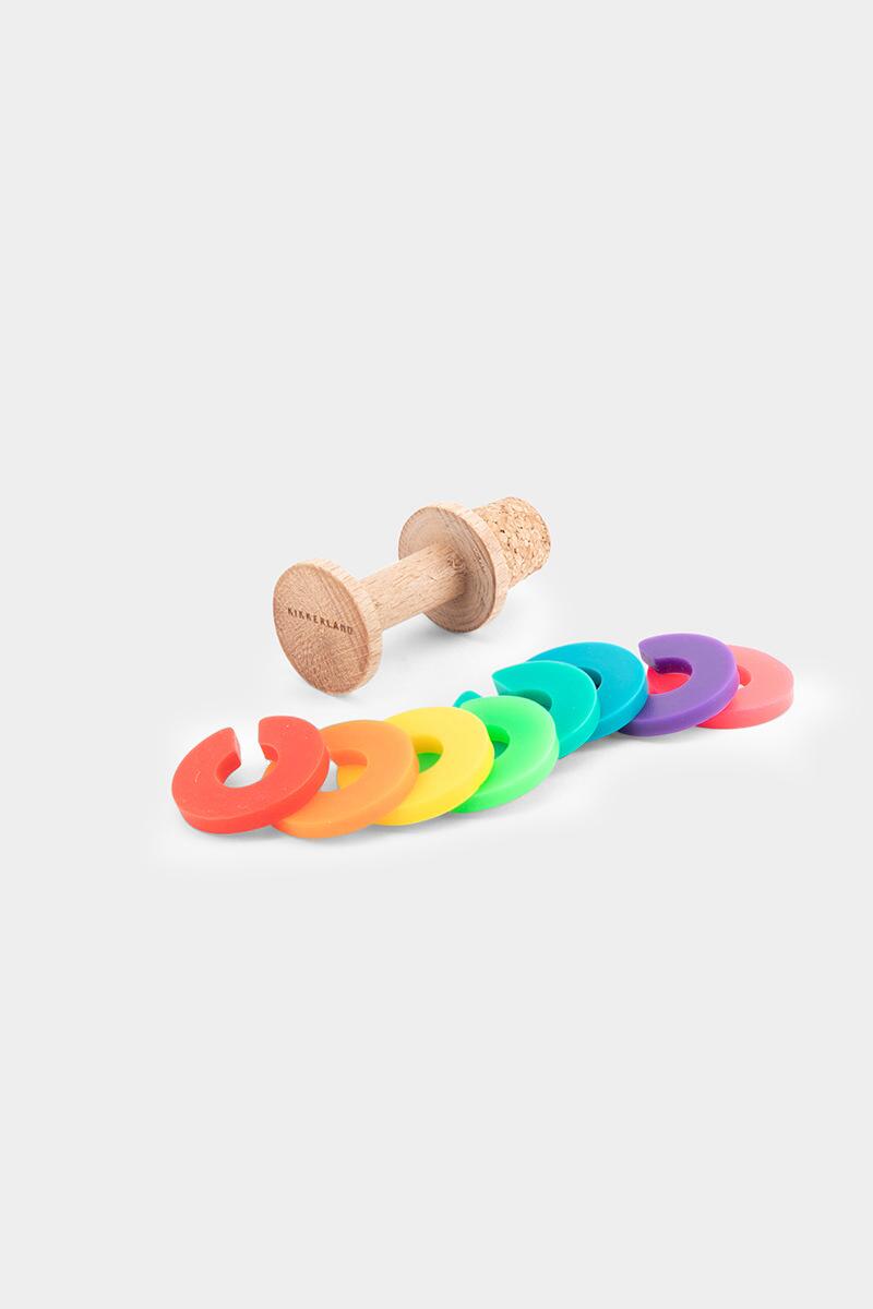 rainbow wine rings and stopper displayed separately on a white background