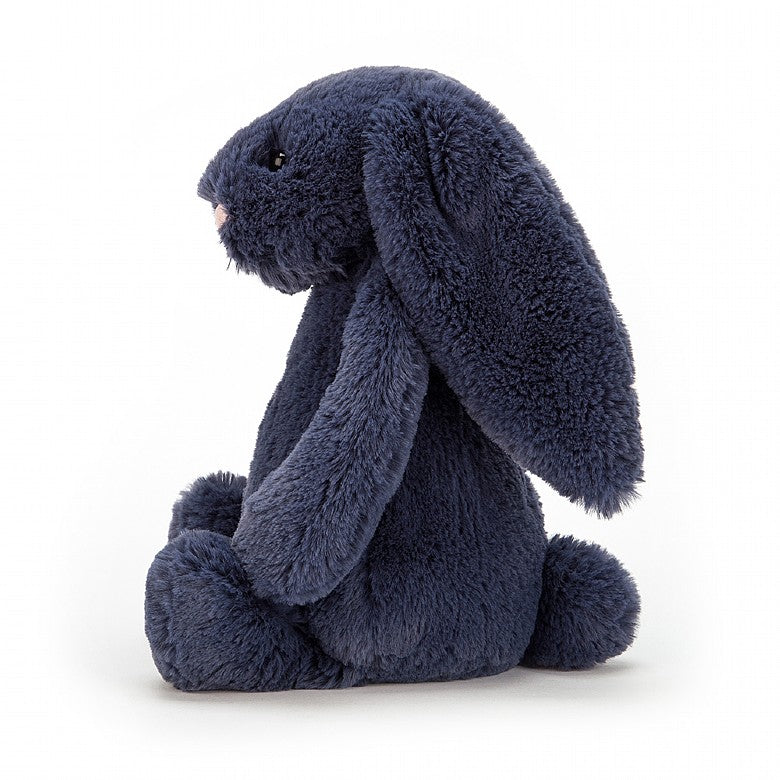 side view of the navy blue bashful bunny on a white background