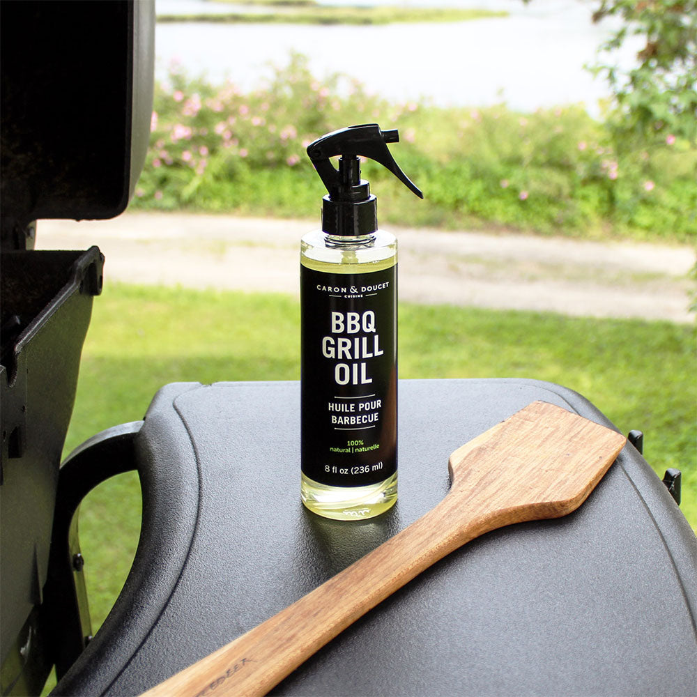 bbq grill cleaning oil displayed beside a grill outside