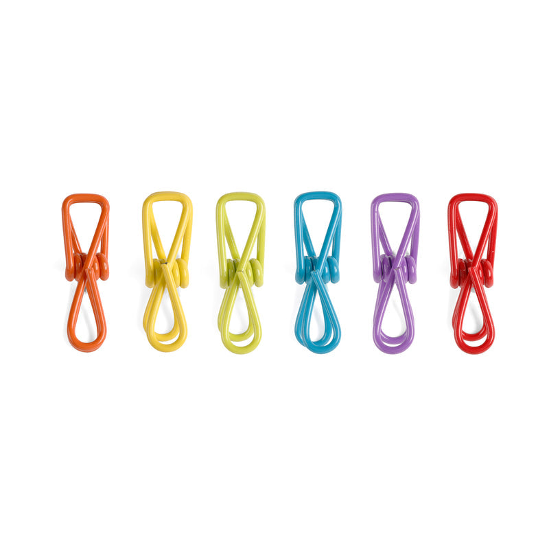 six different colored  multi purpose clips on a white background