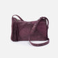 front view of the plum whipstitch paulette small crossbody on a white background