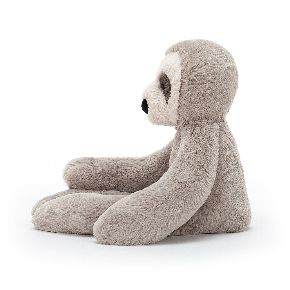 side view of the small gray bailey sloth plush toy displayed on a white background