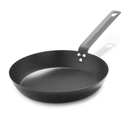black carbon steel 10 inch frypan on a white background
