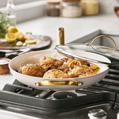 chicken being cooked in the taupe reserve covered frypan on a stovetop