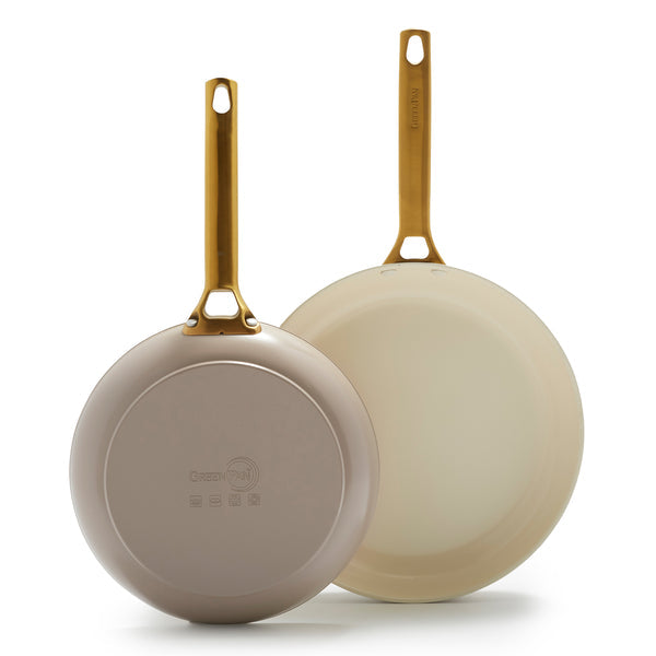 large and small taupe fry pans on white background.