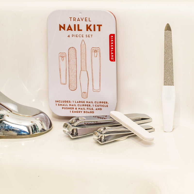 nail kit items arranged on a bathroom counter.