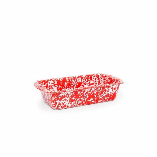 red loaf pan on a white background