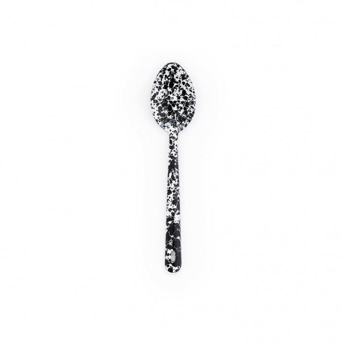 black serving spoon on a white background