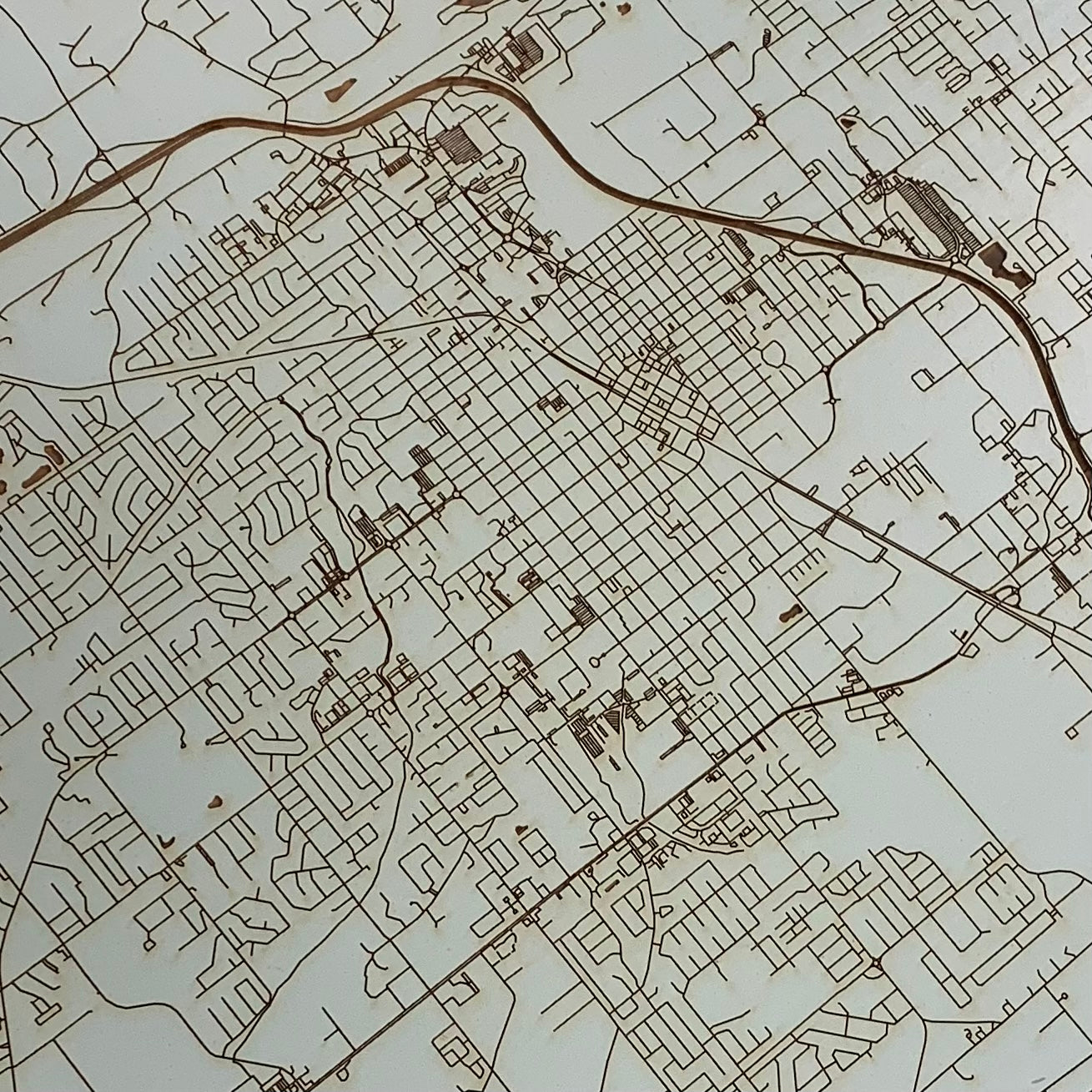 close up view of the burnt wood map of conway in aqua