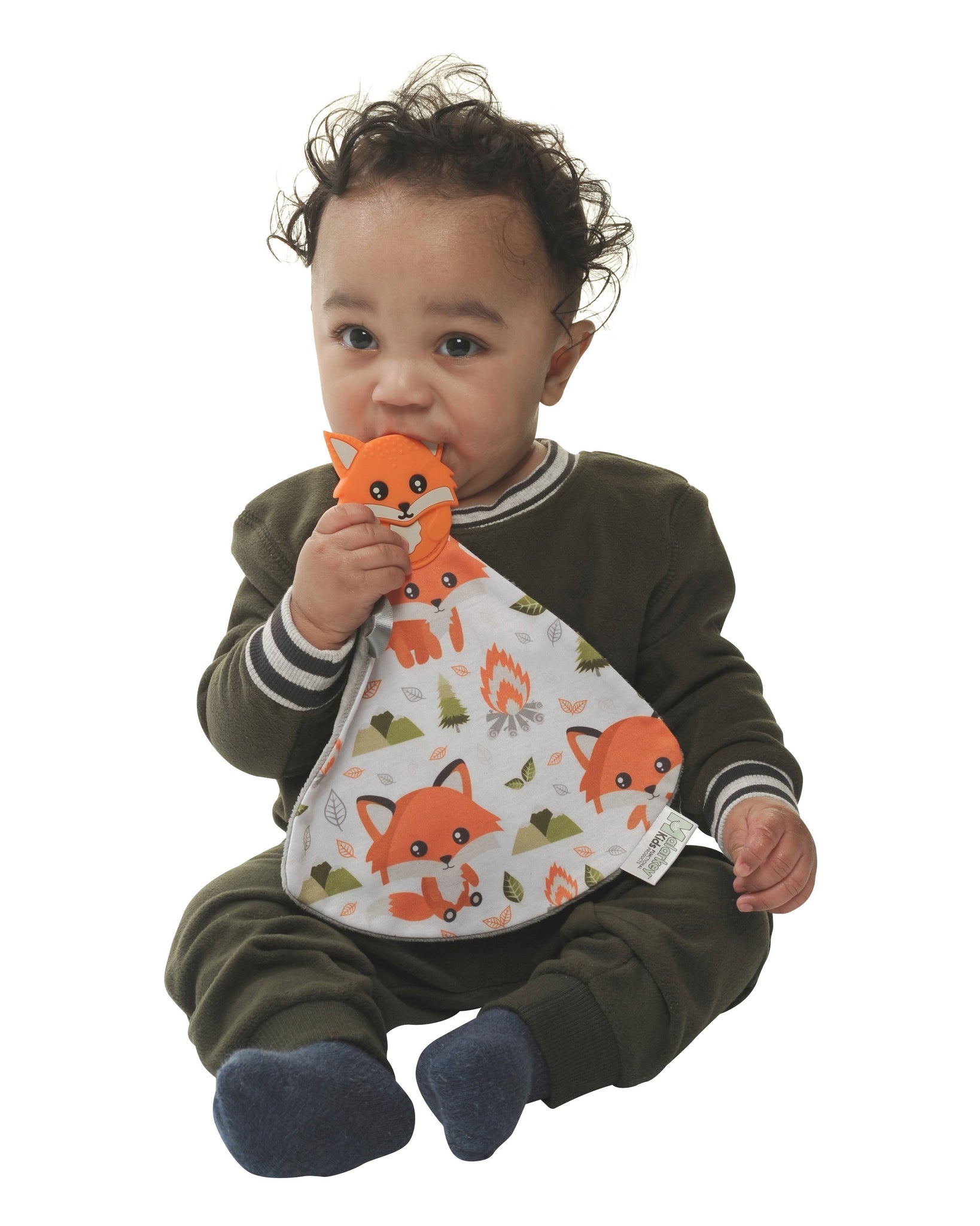 a little boy chewing on the fox munch it blanket against a white background