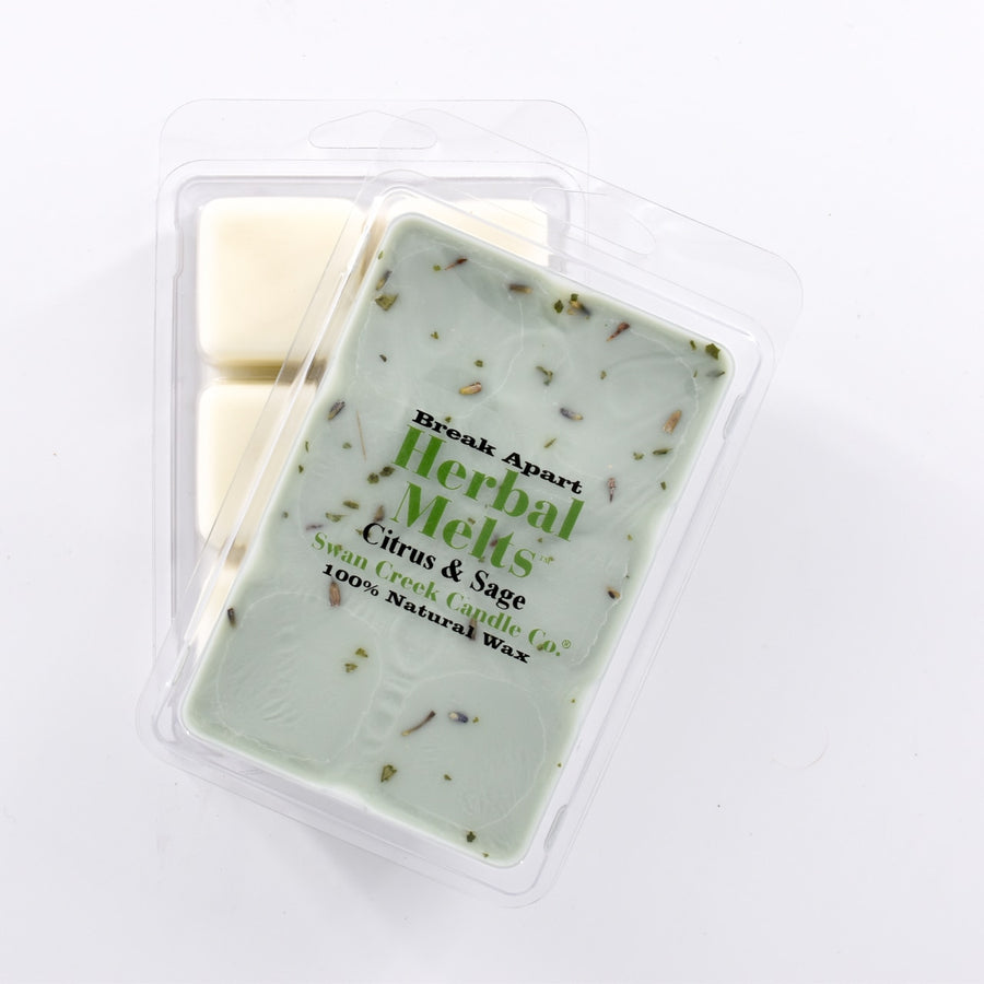 sage colored wax with bits of dried sage on top in packaging with another package showing the bottom of the wax melts break apart design.