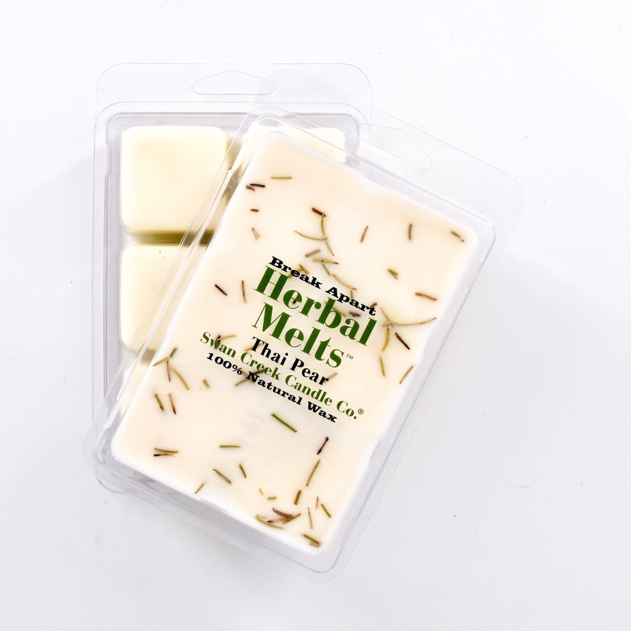 ivory colored wax with dried herbs on top in packaging with another package showing the bottom of the wax melts break apart design.