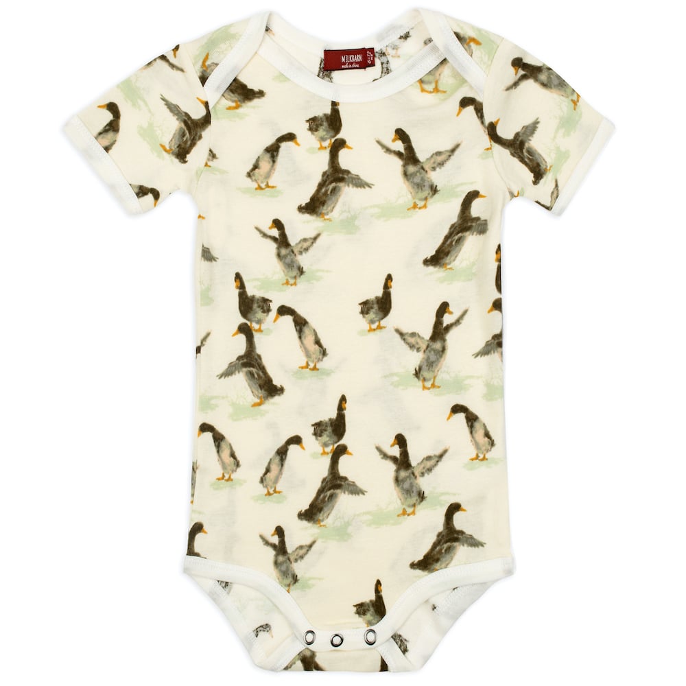 cream onsie with all-over duck pattern.