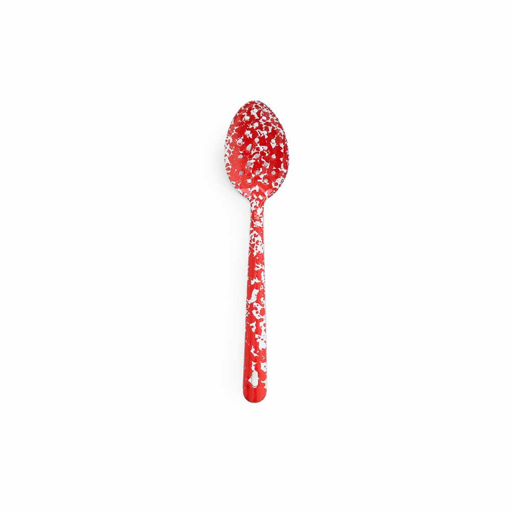 red slotted spoon on a white background