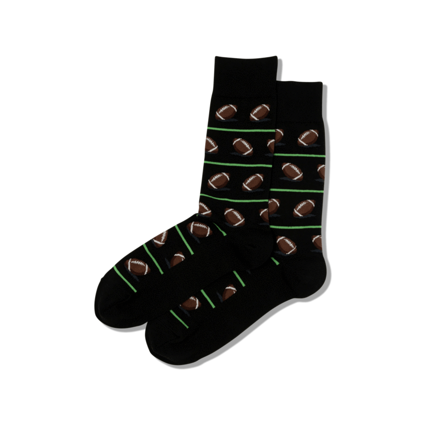men's football socks are black with green lines and footballs all over and displayed against a white background