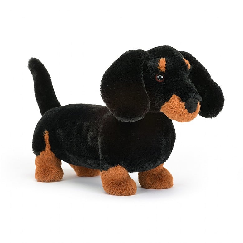 front angled view of freddie sausage dog plush toy is tan and black displayed against a white background