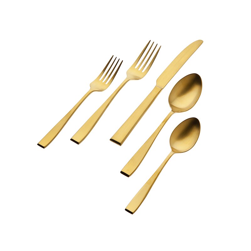 the set of five flagstaff gold flatware  on a white background