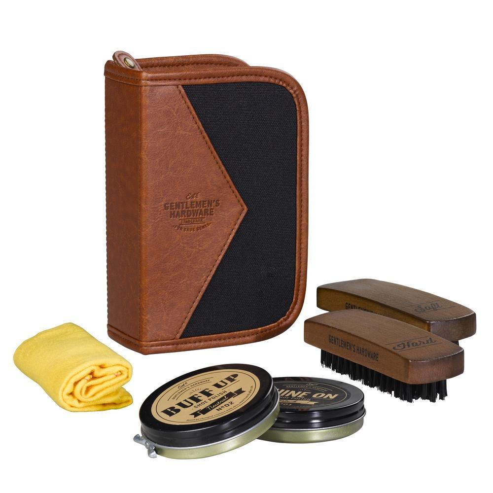 the shoe shine kit pieces displayed beside the case on a white background