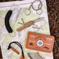 the entire great outdoors kit displayed on a map on the ground 