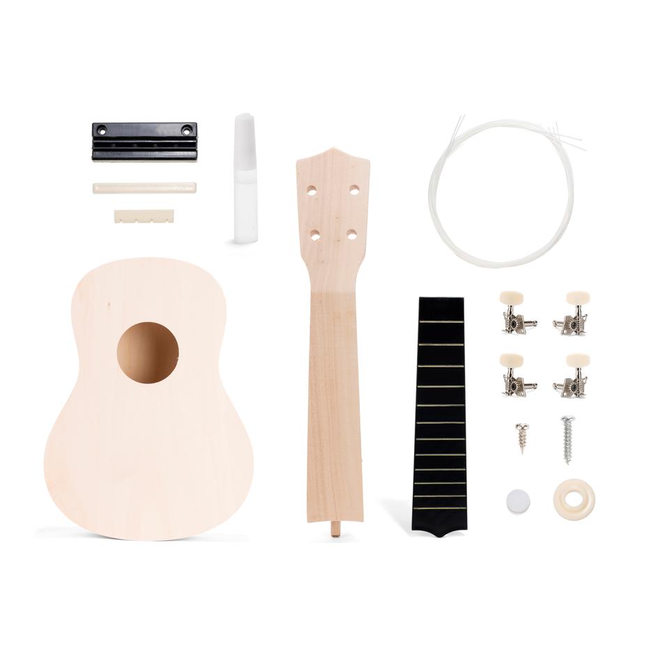 the disassembled parts of make your own ukulele on a white background