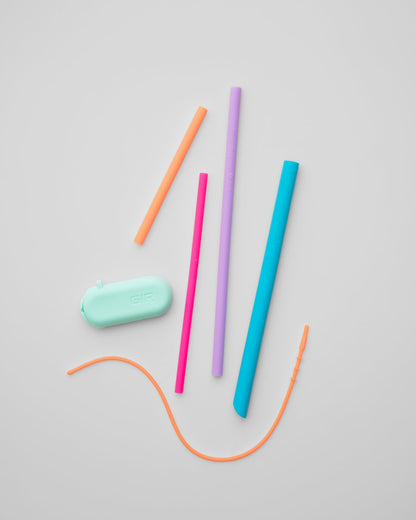 6 piece silicone reusable straw set displayed on a light gray background