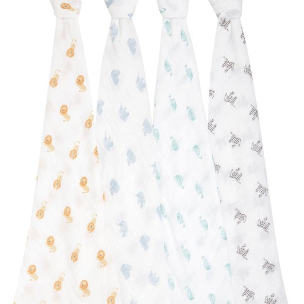 four animal kingdom cotton muslin swaddles hanging on a white background