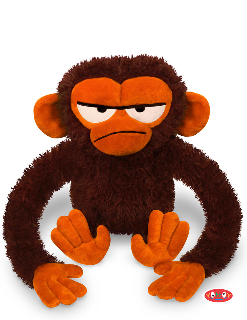 plush brown monkey making a grumpy face on white background