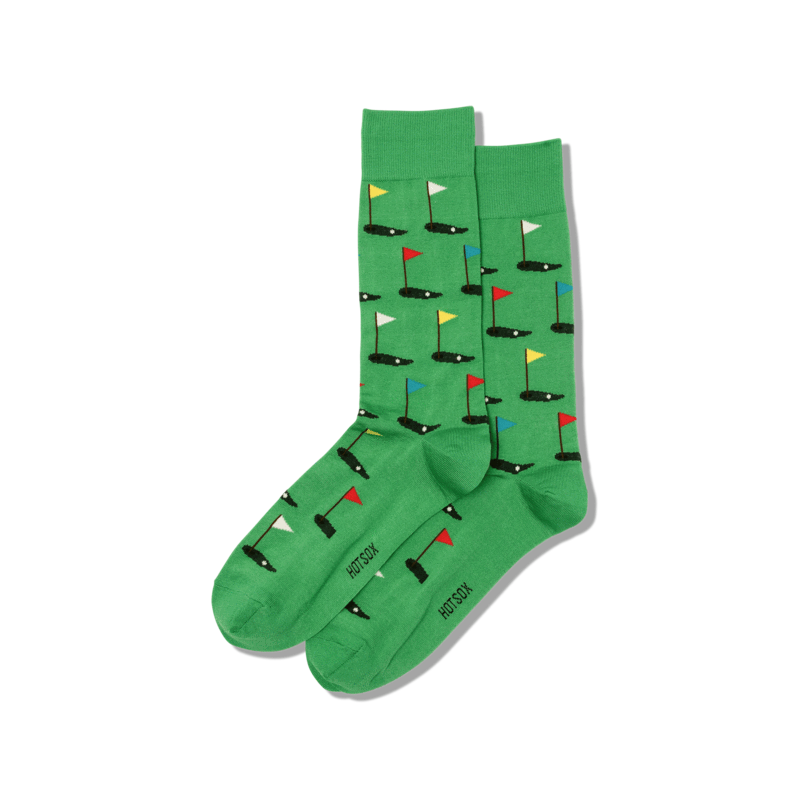 men's golf crew socks are green with putting t's all over and displayed against a white background