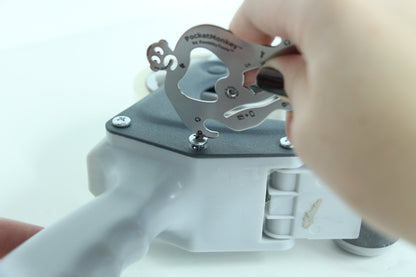 hand using PocketMonkey tool to tighten a screw.