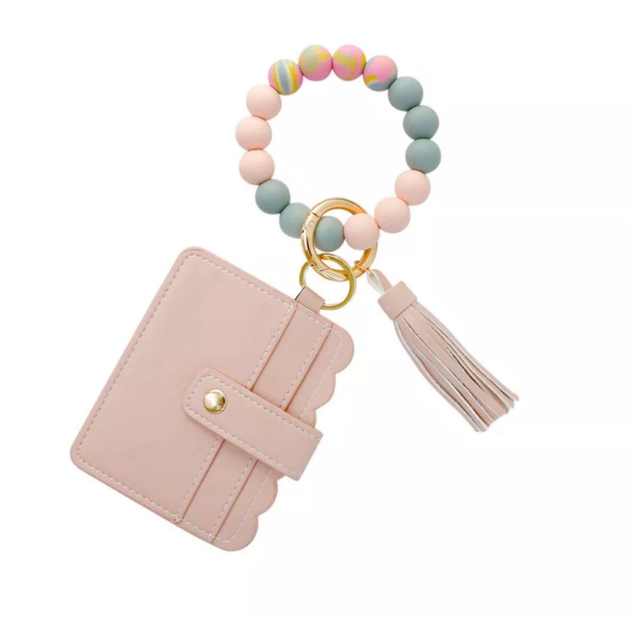 colorful silicone bracelet with pink wallet and tassel attached to it.