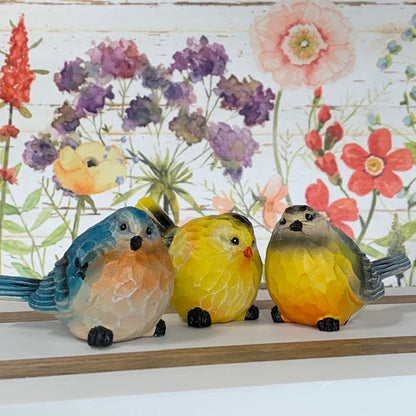 all three styles of colorful birds displayed against a floral picture